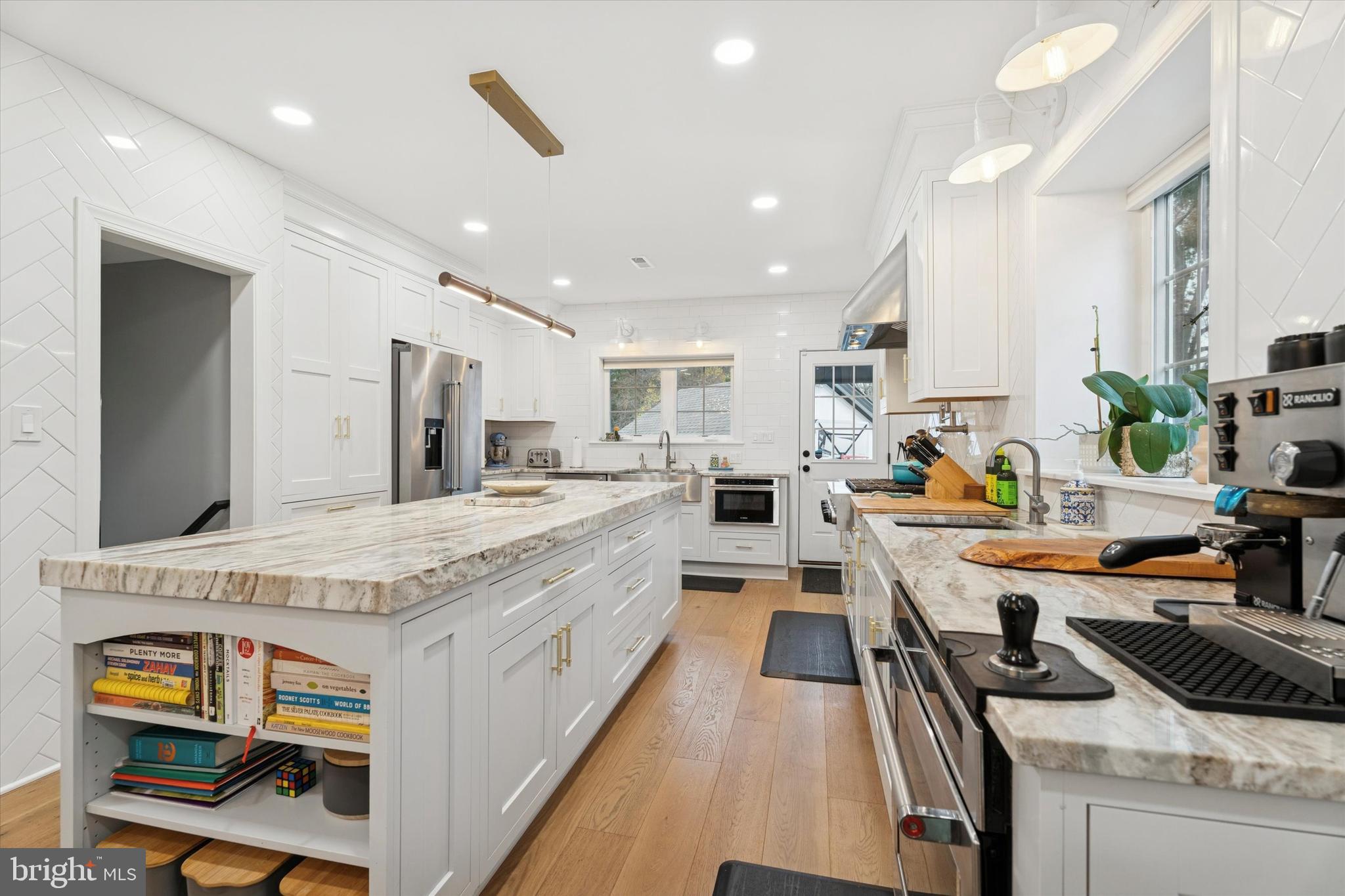 603 Old Gulph Road Penn Valley, PA 19072 - Photo 3 of 58 a large kitchen with a large counter top appliances and cabinets