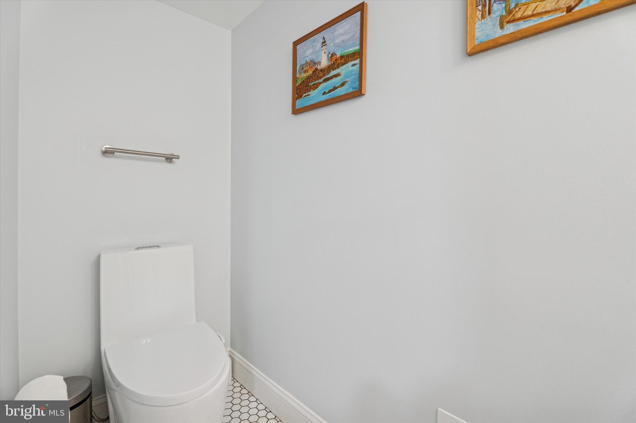 603 Old Gulph Road Penn Valley, PA 19072 - Photo 34 of 58 a white toilet sitting next to a white wall