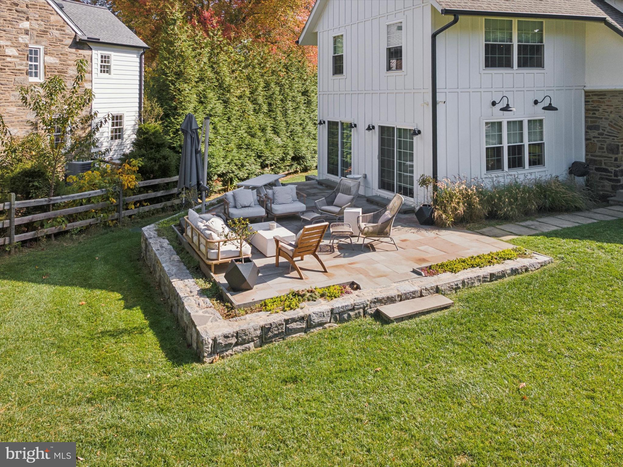 603 Old Gulph Road Penn Valley, PA 19072 - Photo 38 of 58 a view of a patio with chairs and a yard