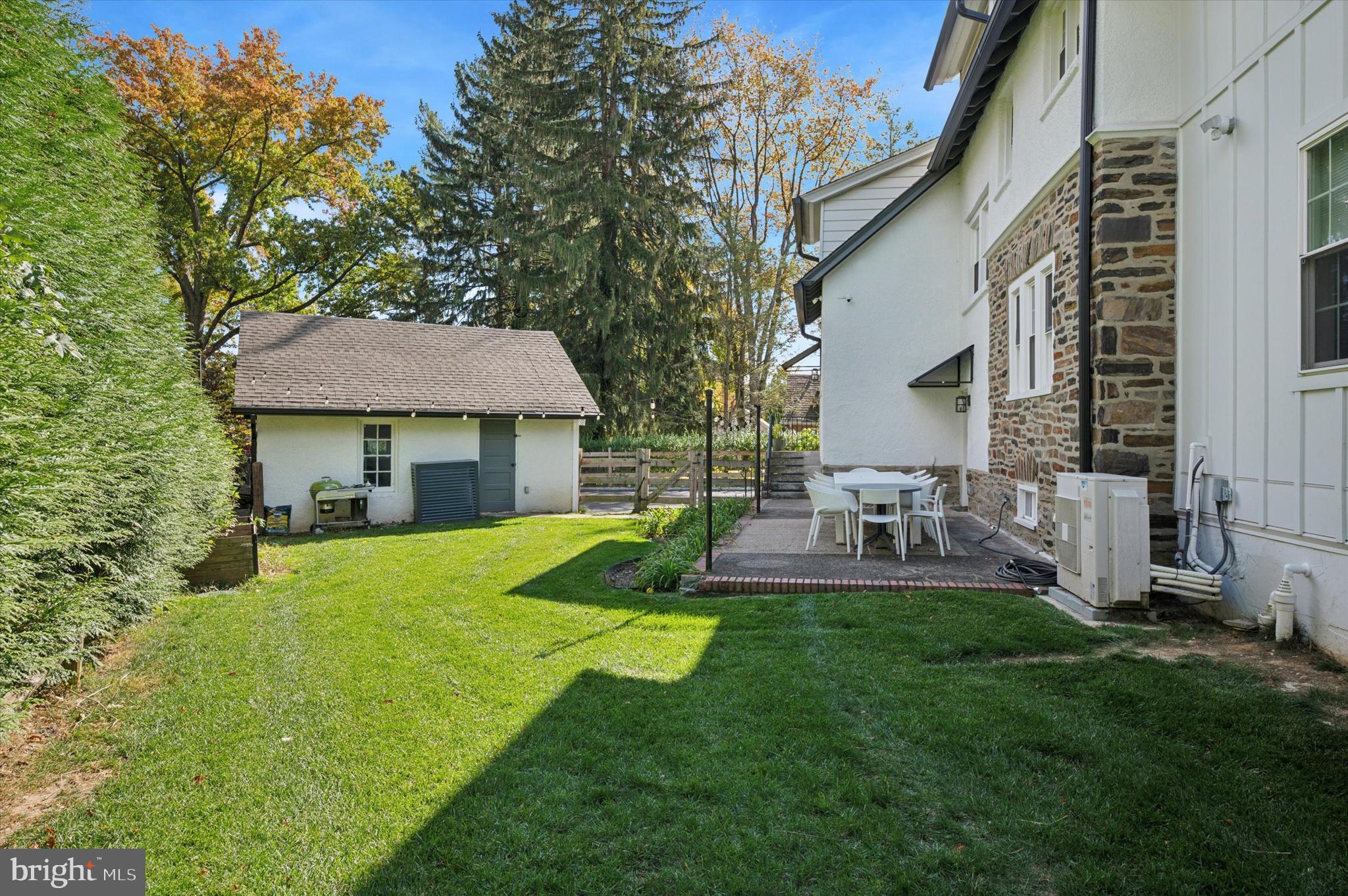603 Old Gulph Road Penn Valley, PA 19072 - Photo 40 of 58 a view of house with a big yard potted plants and a large tree