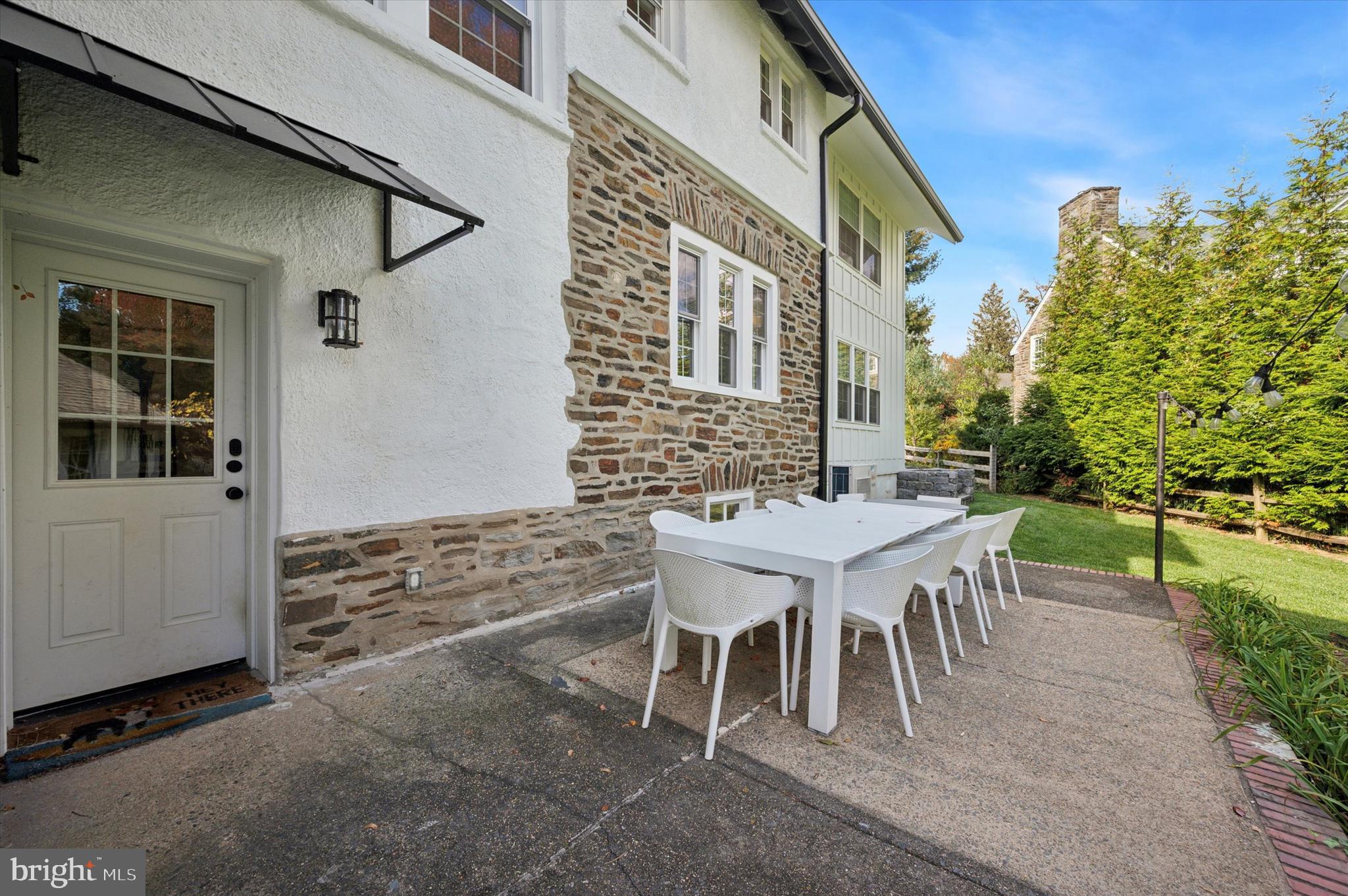 603 Old Gulph Road Penn Valley, PA 19072 - Photo 41 of 58 a backyard of a house with table and chairs