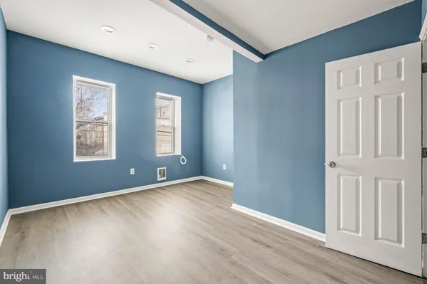 a view of an empty room with stairs