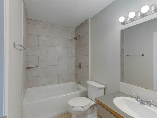 a bathroom with a bathtub toilet and sink