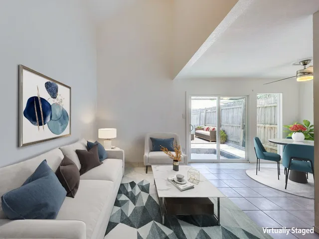 a living room with furniture and a table