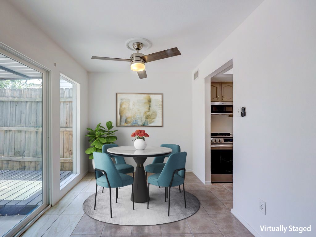 1710 Cinnamon Path Austin, TX 78704 - Photo 21 of 40 a view of a dining room with furniture and a potted plant