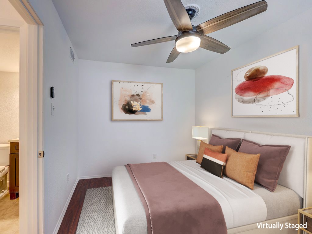 1710 Cinnamon Path Austin, TX 78704 - Photo 23 of 40 a bedroom with a bed and a painting on the wall