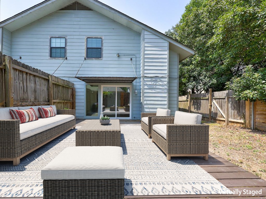 1710 Cinnamon Path Austin, TX 78704 - Photo 24 of 40 a view of a patio with couches and table and chairs with wooden floor and fence