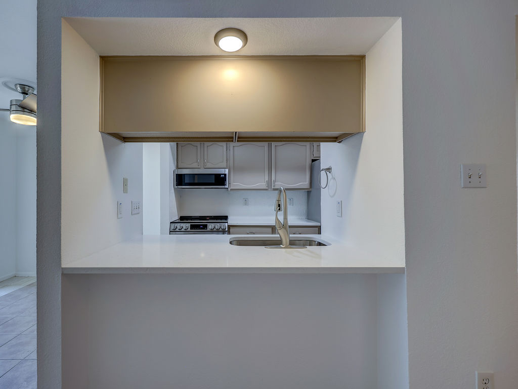 1710 Cinnamon Path Austin, TX 78704 - Photo 31 of 40 a view of a kitchen with a sink and a stove