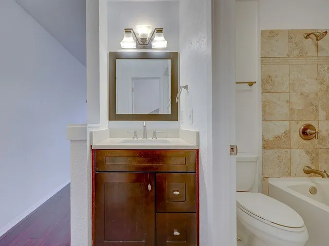a bathroom with a bathtub and a toilet