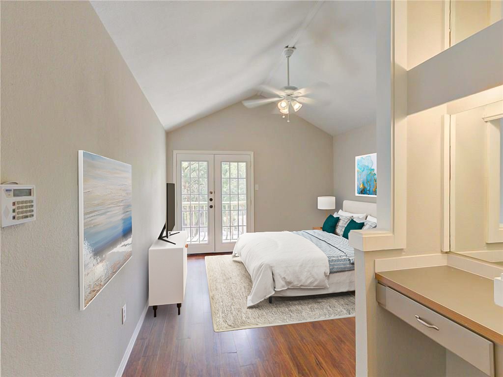 1710 Cinnamon Path Austin, TX 78704 - Photo 5 of 40 a bedroom with a large bed and a chandelier