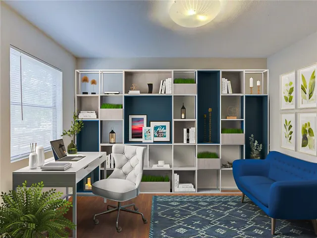 a living room with furniture and a book shelf