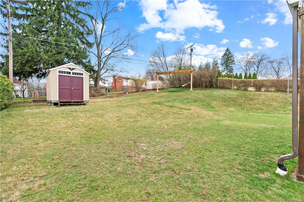 5140 Raintree Drive Pittsburgh, PA 15236 - Photo 24 of 26 a backyard of a house with lots of green space