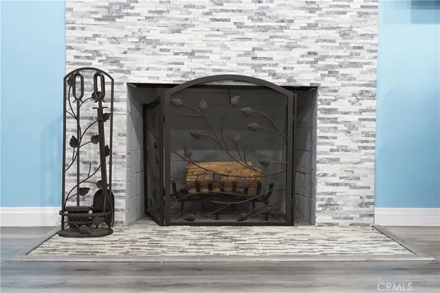 a stone fireplace with a sink