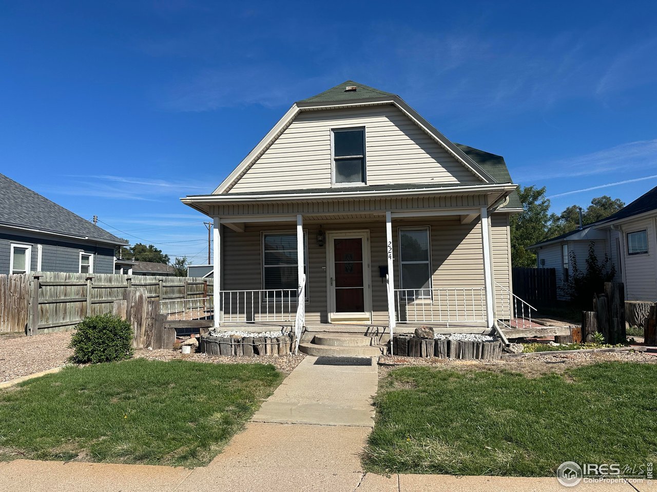 224 State Street Sterling, CO 80751 - Photo 1 of 23 a front view of a house with a yard
