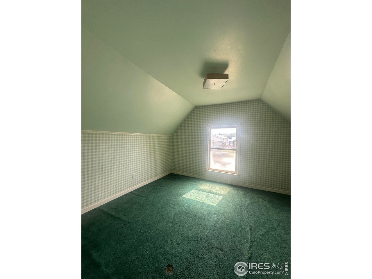 224 State Street Sterling, CO 80751 - Photo 12 of 23 a view of an empty room with a window