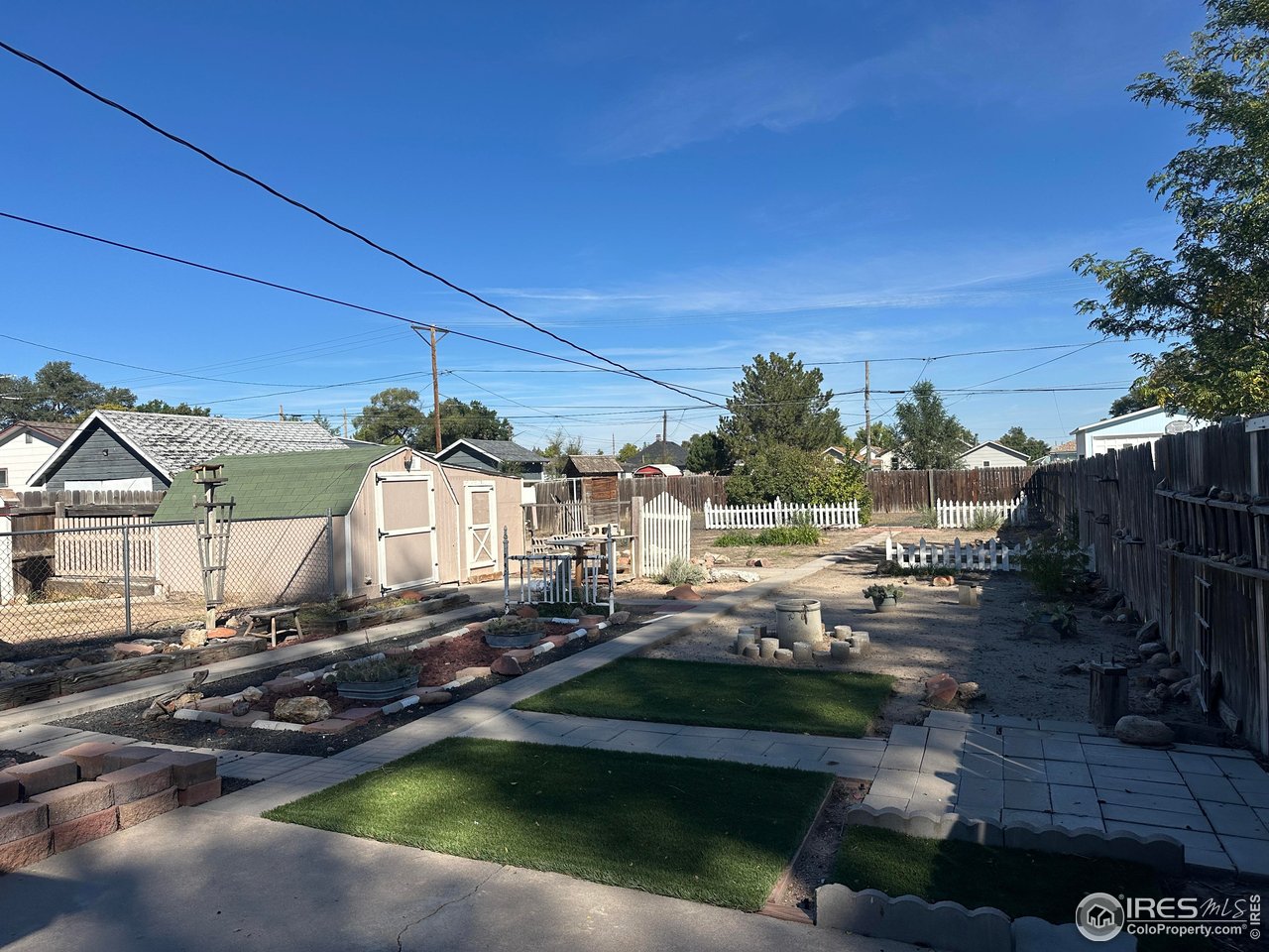 224 State Street Sterling, CO 80751 - Photo 18 of 23 a view of a house with backyard and sitting area