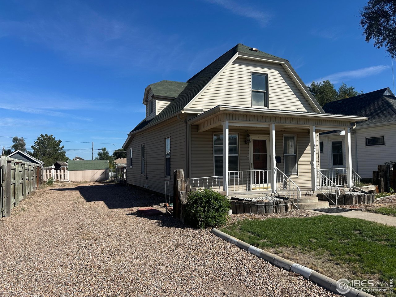 224 State Street Sterling, CO 80751 - Photo 2 of 23 a front view of a house with garden