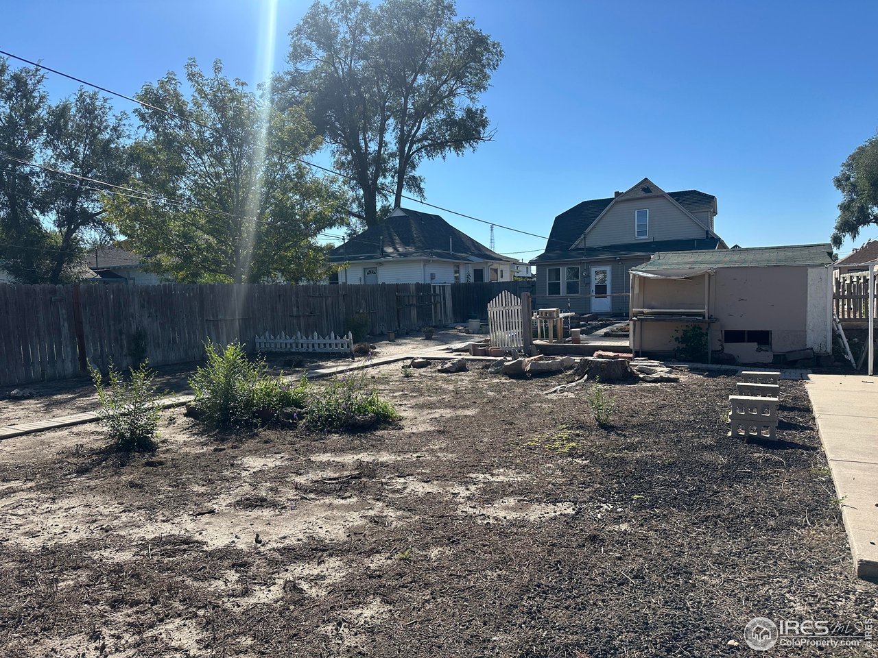 224 State Street Sterling, CO 80751 - Photo 22 of 23 a view of a yard with a slide