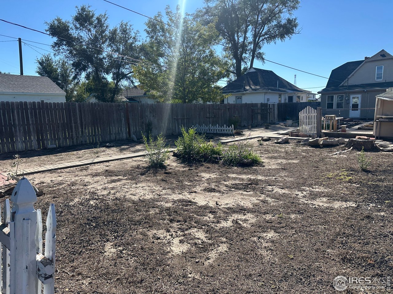 224 State Street Sterling, CO 80751 - Photo 23 of 23 a backyard of a house with table and chairs