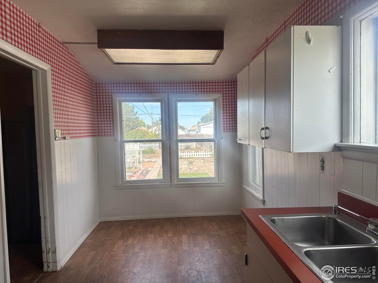 224 State Street Sterling, CO 80751 - Photo 7 of 23 storage and utility room with window