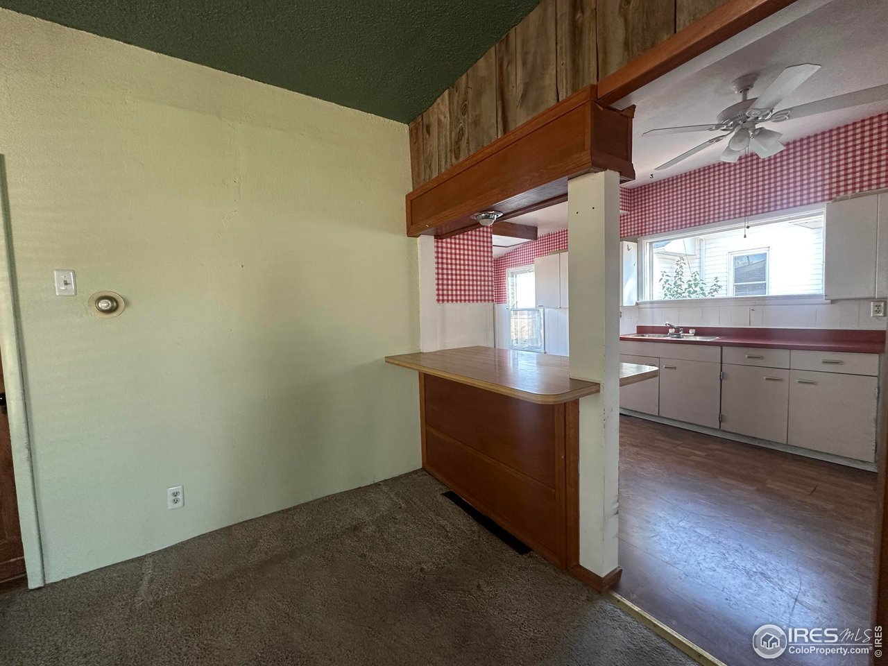224 State Street Sterling, CO 80751 - Photo 8 of 23 a room with stainless steel appliances wooden floor and window