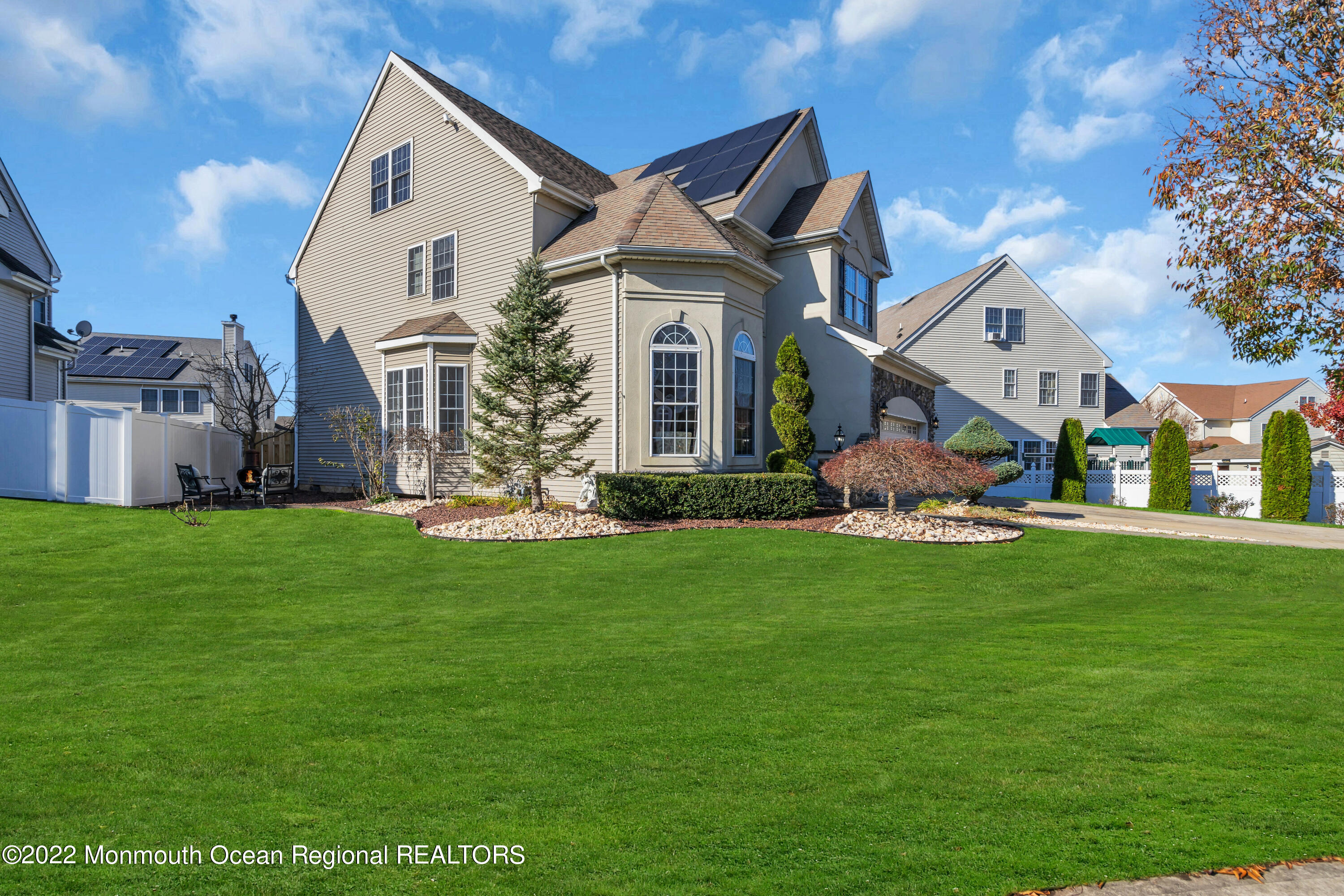 6 Rockspray Court Howell, NJ 07731 - Photo 3 of 16 a front view of a house with a garden and yard