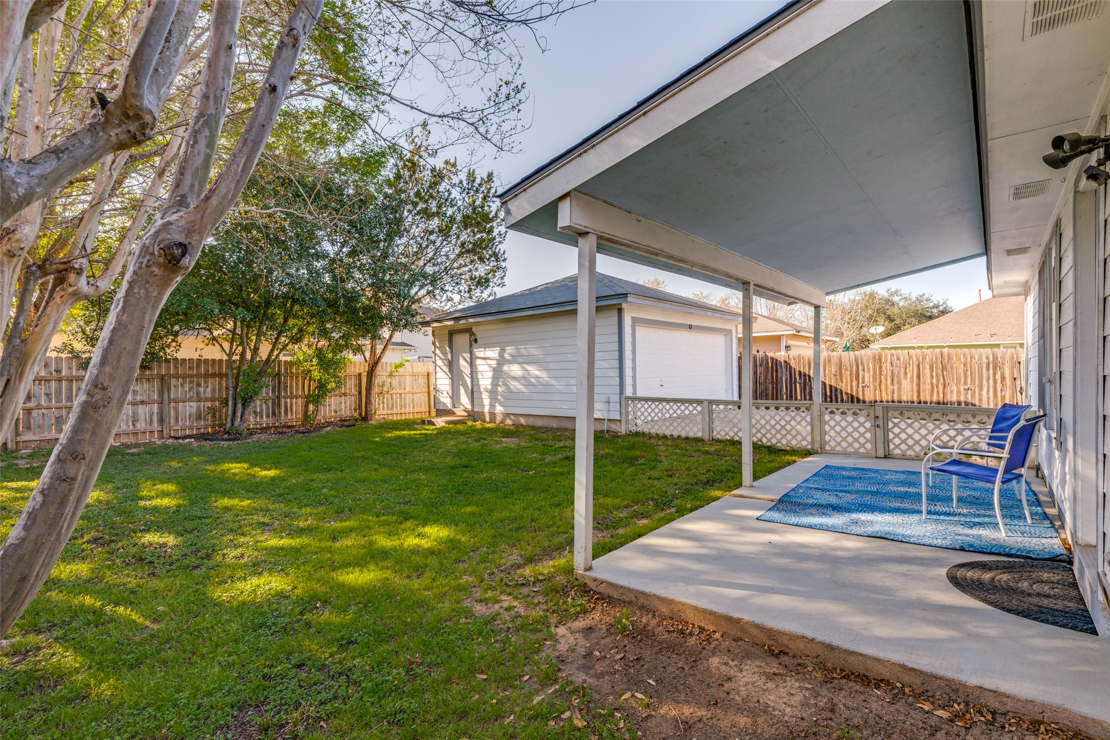 272 Tobin Drive Buda, TX 78610 - Photo 20 of 25 Fenced backyard with an outbuilding and a patio