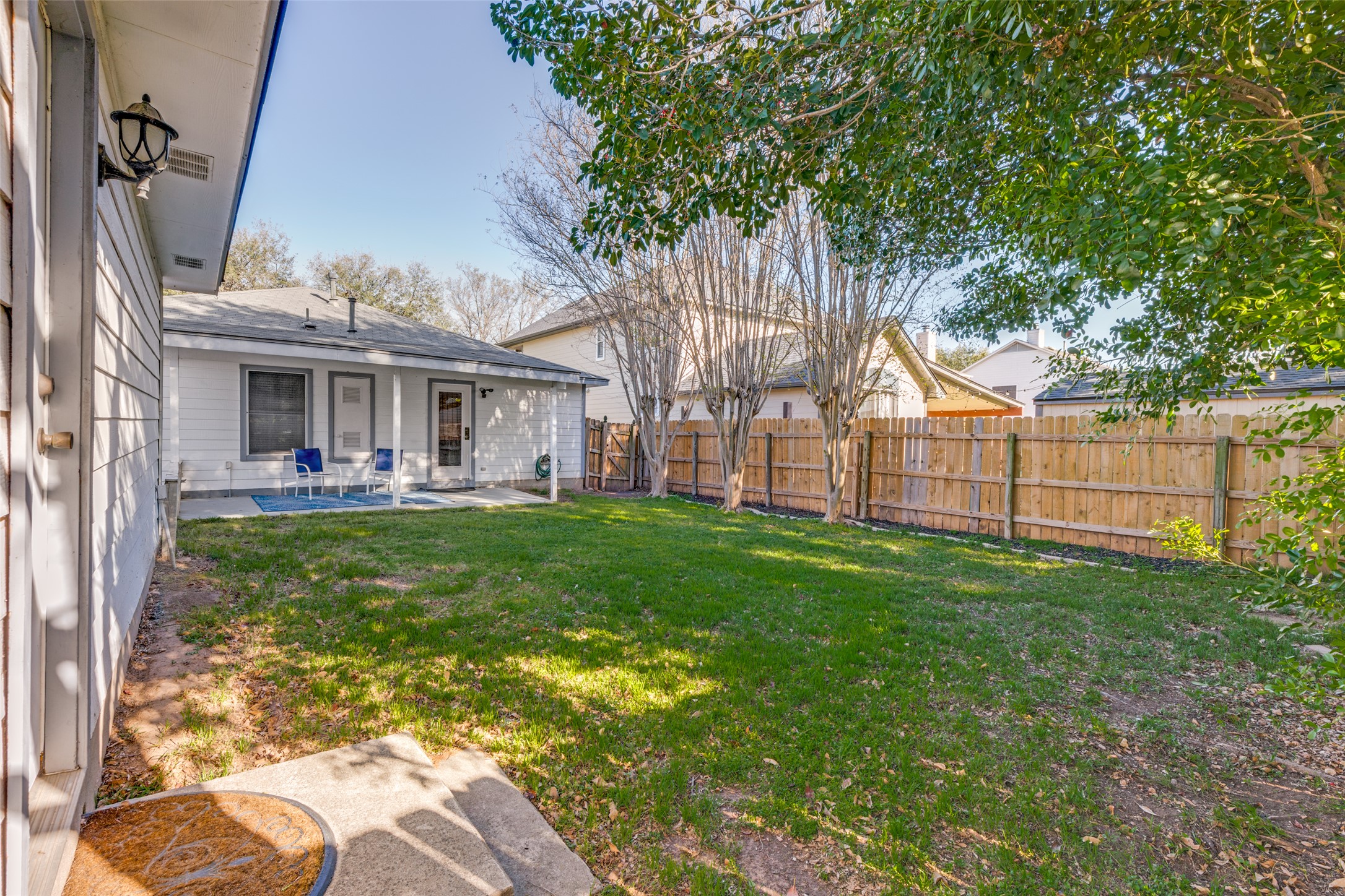 272 Tobin Drive Buda, TX 78610 - Photo 23 of 25 Fenced backyard with a patio