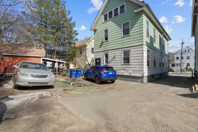 a view of a car parked in front of a house