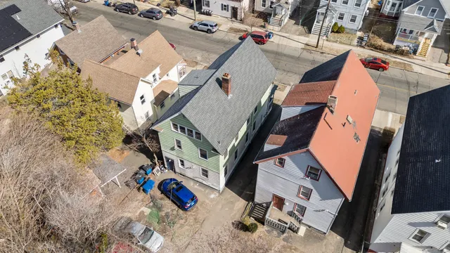 an aerial view of a house with outdoor space