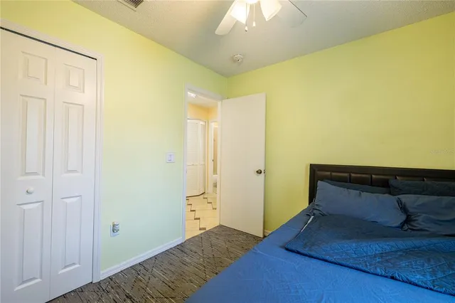 a room with a bed and a chandelier