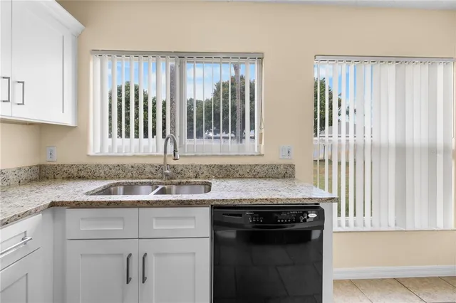 a kitchen with a stove and a sink