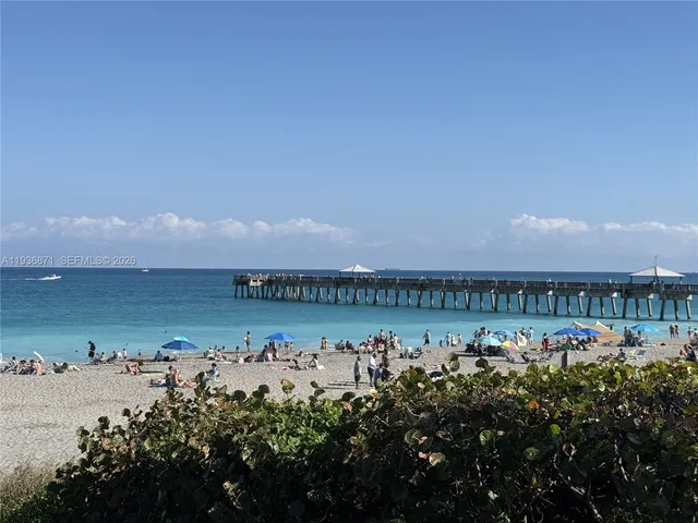 a view of balcony with wooden floor
