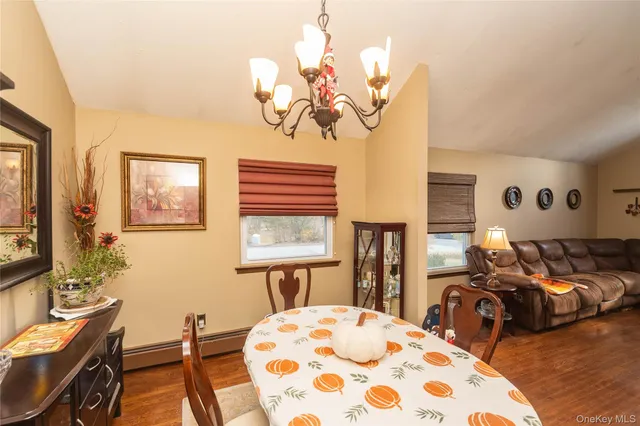 a bedroom with bed and wooden floor