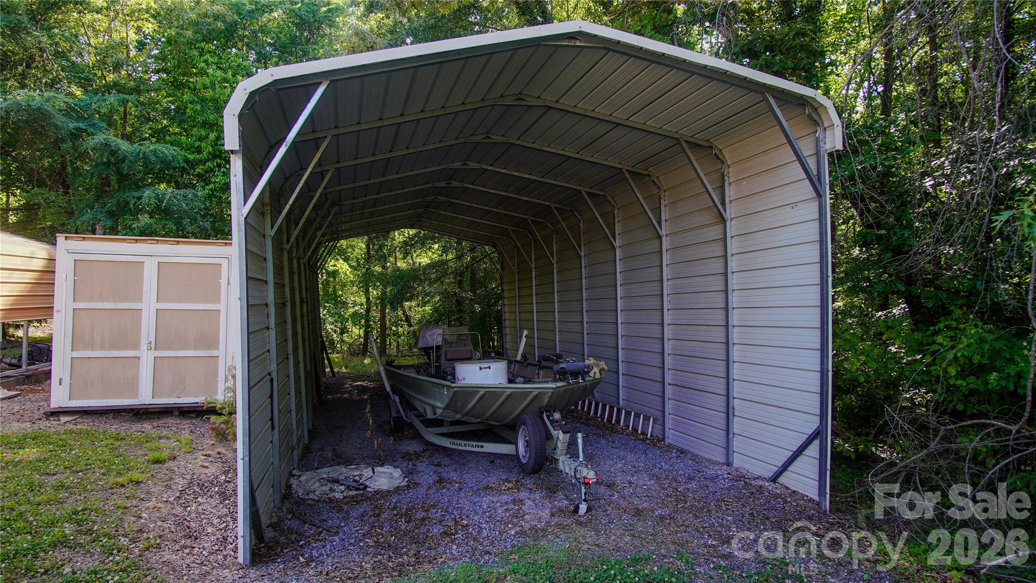 204 Old Stage Coach Road Lawndale, NC 28090 - Photo 27 of 30 a view of backyard with a barn and a tub