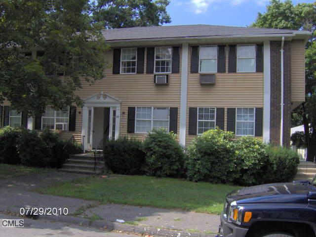 84 Angel Drive, Unit C Waterbury, CT 06708 - Photo 1 of 1 a front view of a house with garden and porch