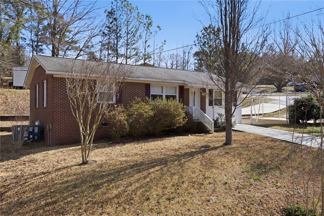 108 Hodge Street Abbeville, SC 29620 - Photo 39 of 39 Brick facade home offers inviting curb appeal and a convenient carport.