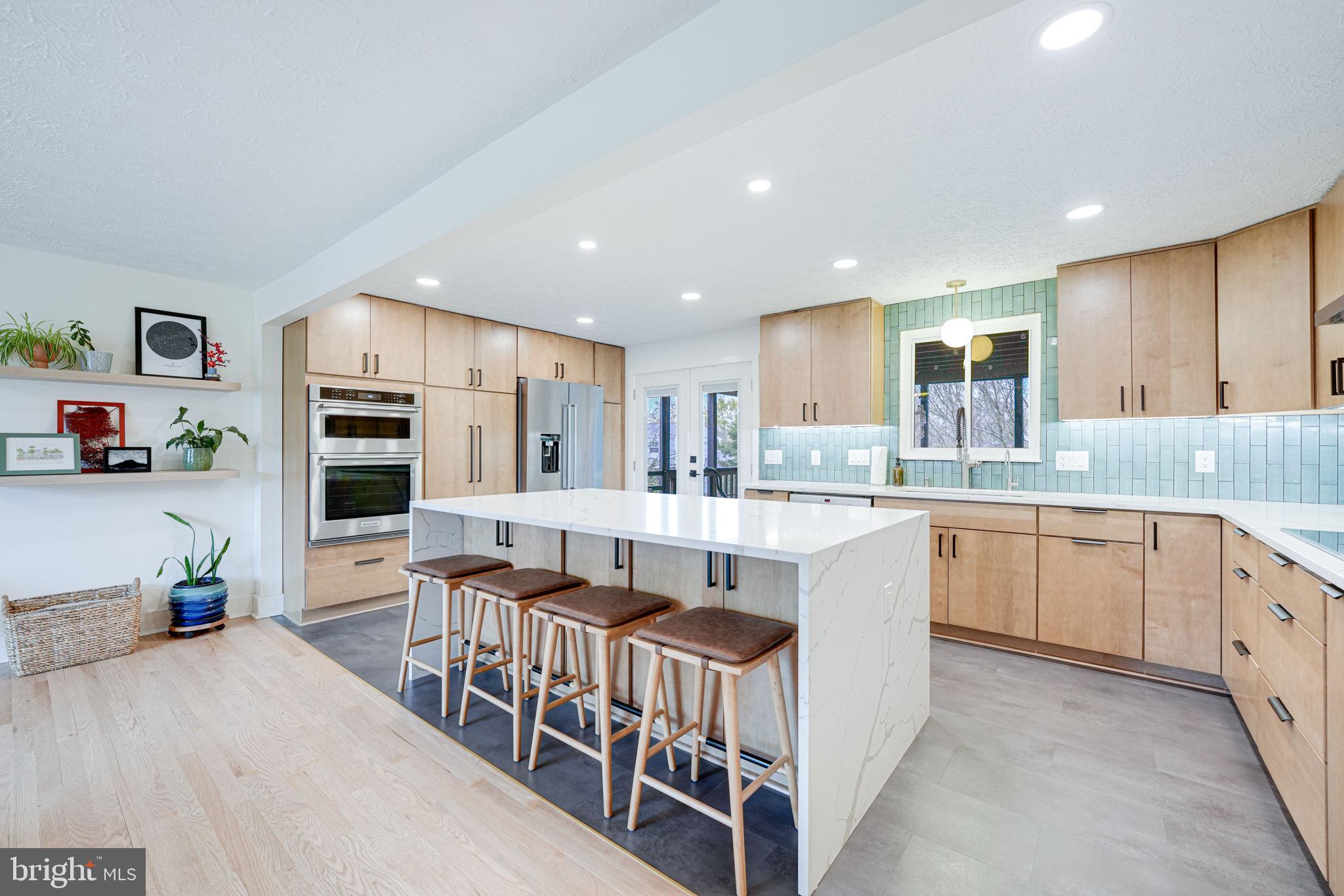 4425 Cub Run Road Chantilly, VA 20151 - Photo 11 of 43 a kitchen with stainless steel appliances granite countertop a lot of counter space and cabinets