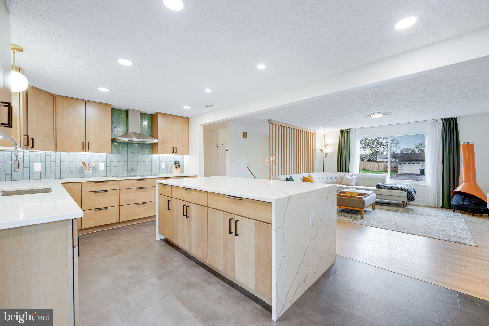 4425 Cub Run Road Chantilly, VA 20151 - Photo 13 of 43 a large white kitchen with a stove a sink a refrigerator and a counter top space