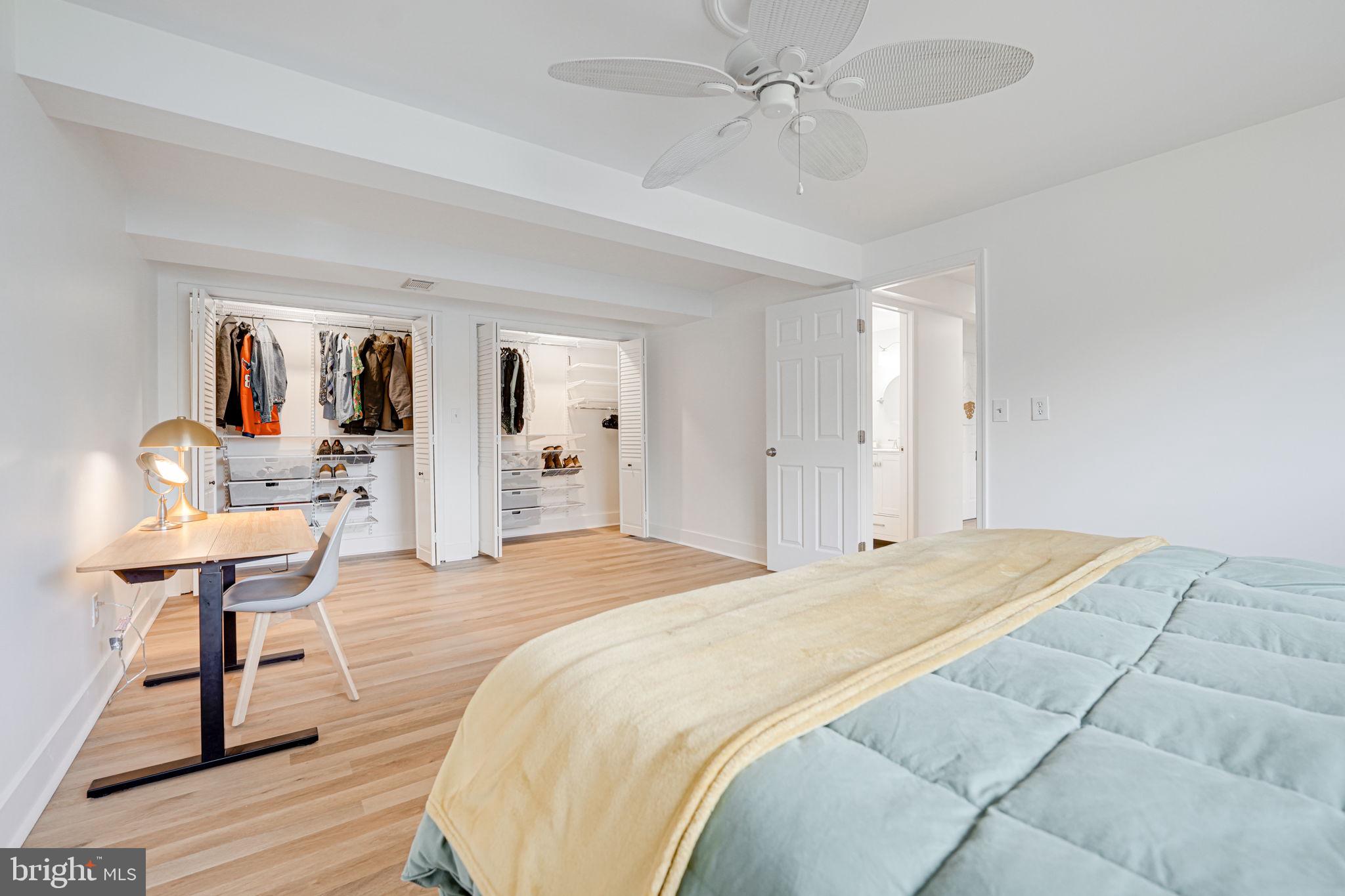 4425 Cub Run Road Chantilly, VA 20151 - Photo 24 of 43 a spacious bedroom with a bed and a table in it