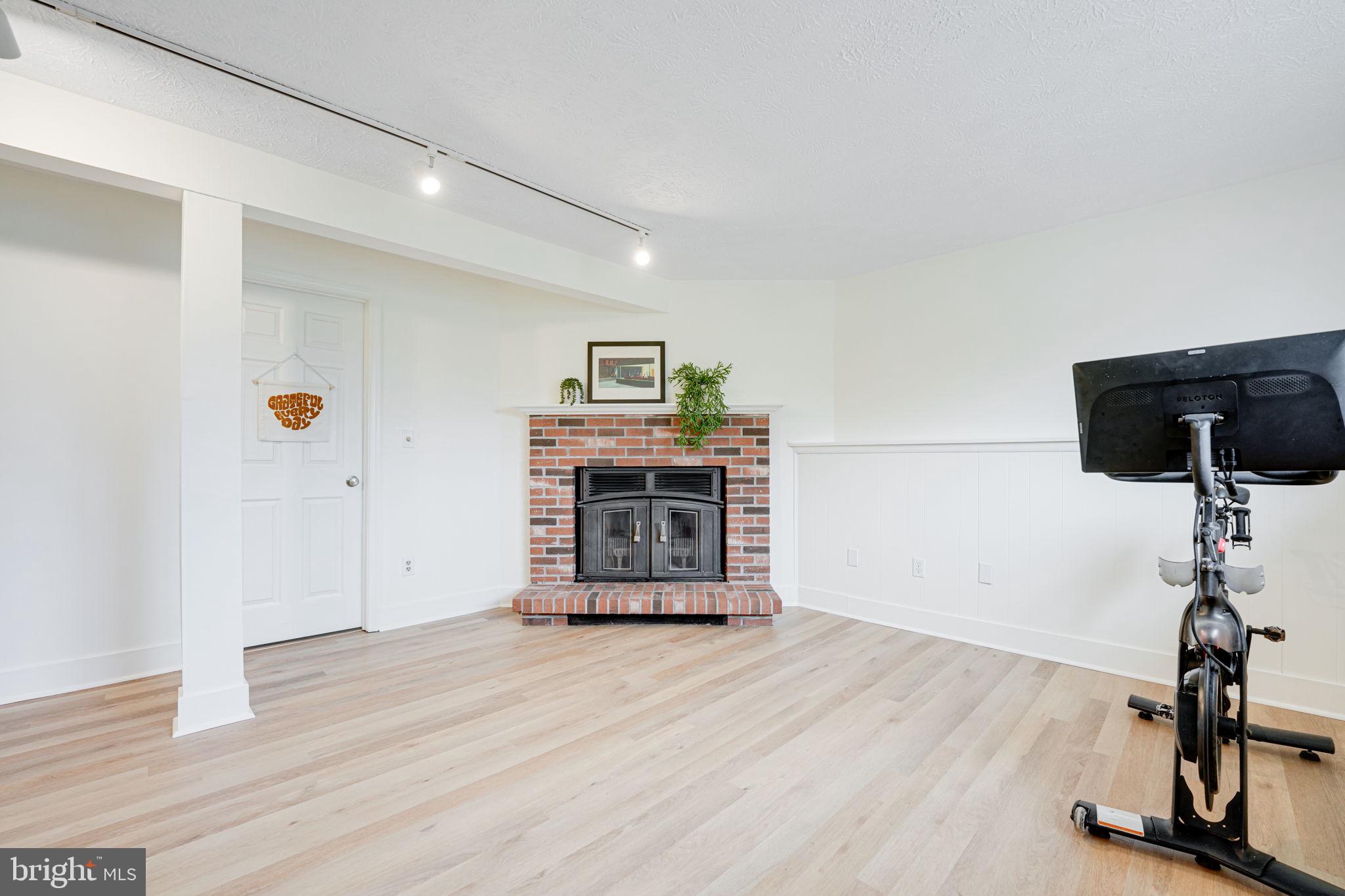 4425 Cub Run Road Chantilly, VA 20151 - Photo 28 of 43 a view of a room with wooden floor and ceiling fan