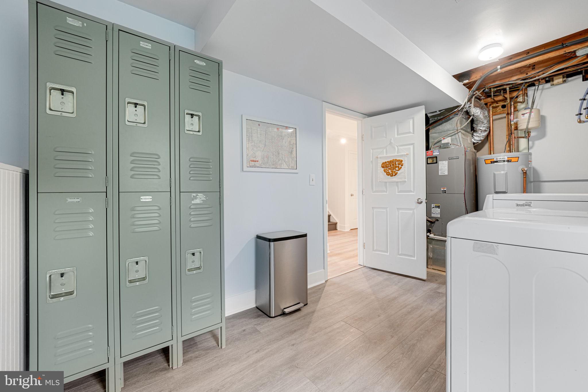 4425 Cub Run Road Chantilly, VA 20151 - Photo 30 of 43 a view of a storage & utility room with closet fridge and wooden floor