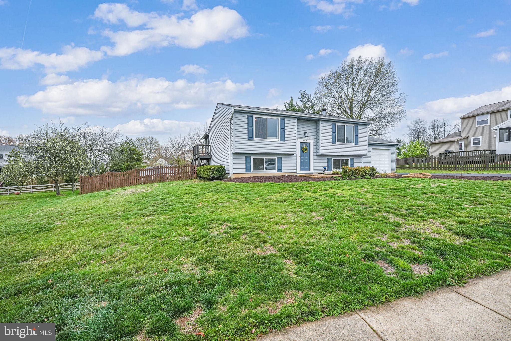 4425 Cub Run Road Chantilly, VA 20151 - Photo 3 of 43 a view of a house with a big yard potted plants and large tree
