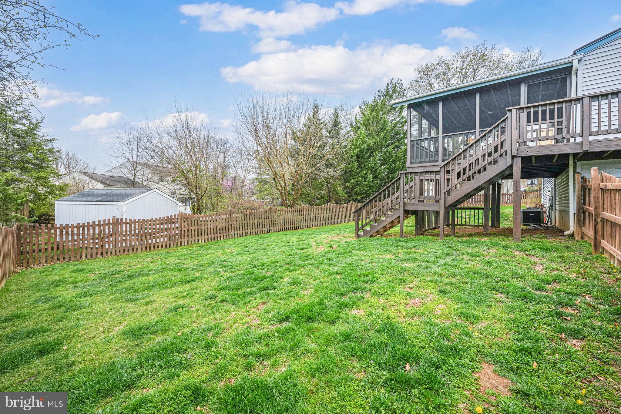 4425 Cub Run Road Chantilly, VA 20151 - Photo 36 of 43 a view of a house with a yard and a wooden deck