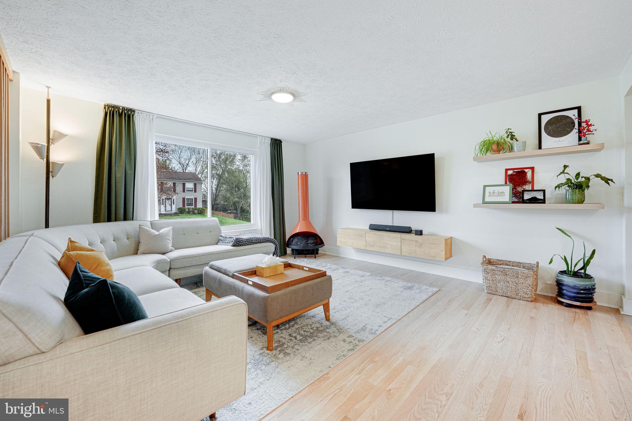 4425 Cub Run Road Chantilly, VA 20151 - Photo 8 of 43 a living room with furniture and a flat screen tv