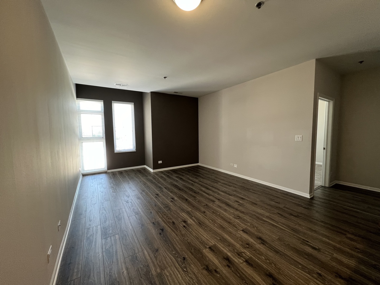 625 Deerfield Road, Unit 402 Deerfield, IL 60015 - Photo 4 of 5 an empty room with wooden floor and windows