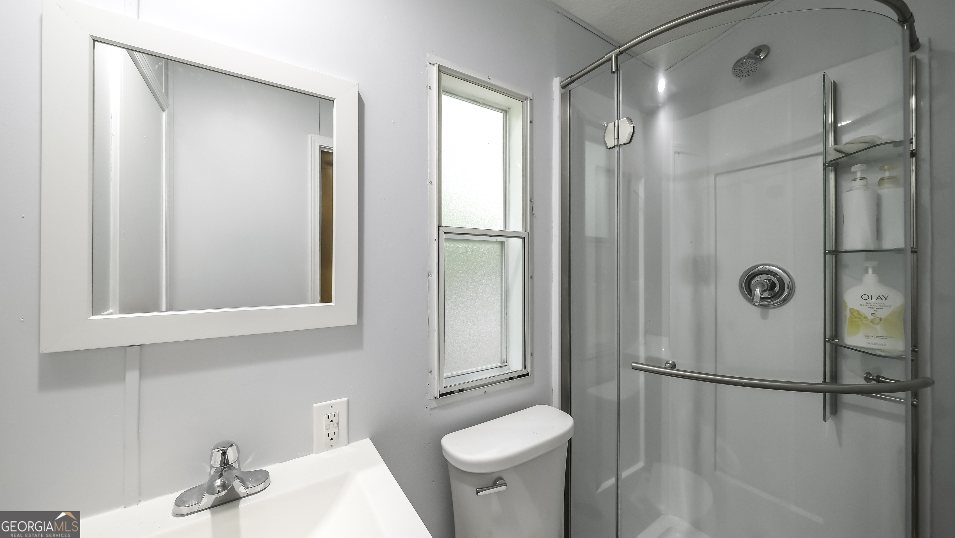 91 Holder Road Temple, GA 30179 - Photo 31 of 40 a bathroom with a shower sink vanity and toilet