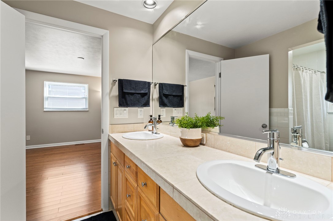 2247 East Whipp Road Dayton, OH 45440 - Photo 28 of 52 This bathroom features a double vanity and recessed lighting.