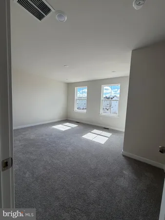 a view of empty room with windows