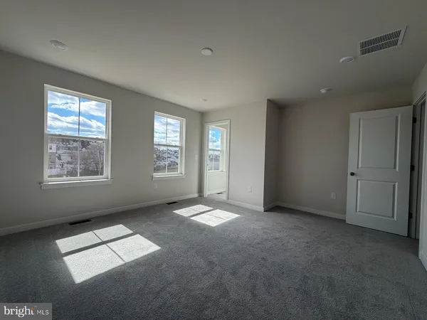 an empty room with windows